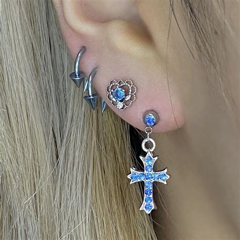 Unleash Your Inner Magic with Cross Piercings